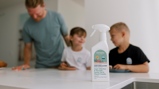 Dad and kids cleaning a kitchen bench with Forsana Everything Cleaner